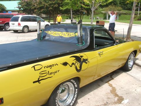 1972 Ford Ranchero - Custom 1972 Ford Ranchero with 'Dragon Slayer' graphics and prominent exhaust stacks.