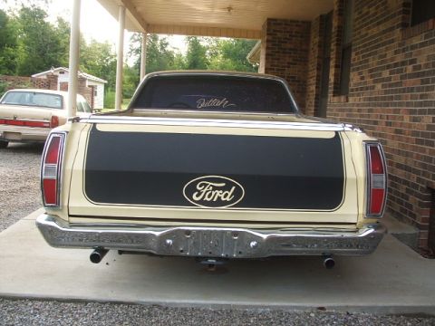 1972 Ford Ranchero - Rear view of a 1972 Ford Ranchero, showing the tailgate and bumper. A second vehicle is visible in the background.