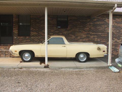 1972 Ford Ranchero - This 1972 Ford Ranchero pickup truck is parked under a carport, showing its side profile.