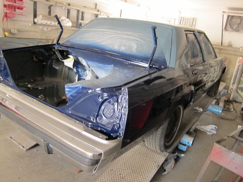 1991 Ford LTD Crown Victoria - Ford Crown Victoria LTD in paint booth with trunk open, undergoing a blue paint job.