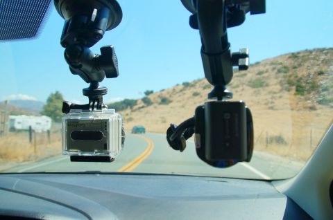 1993 Ford Taurus - Two dashboard cameras, including a GoPro, are mounted on the windshield, looking out at a road.