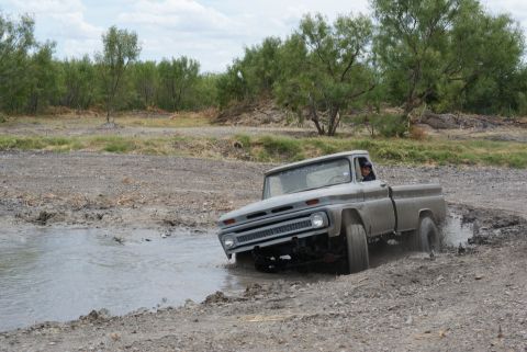 1989 Ford Bronco - This 1964 Chevrolet C10 pickup truck is shown off-roading through a muddy area.