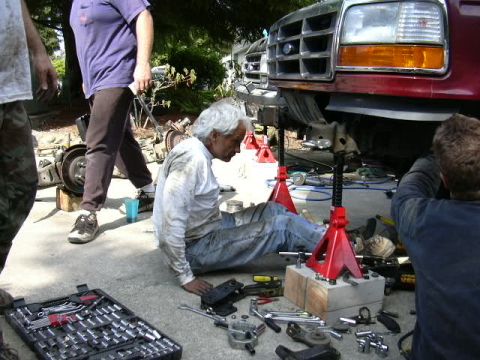 1991 Ford Bronco - Mechanics perform lift kit installation on a 1991 Ford Bronco's front suspension.