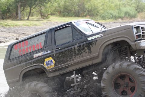 1989 Ford Bronco - Mud bogging 1989 Ford Bronco with "WOOD CONTROL" graphics on the side.