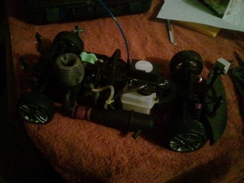 1985 Ford Bronco - Close-up of a remote control car's engine and chassis components.