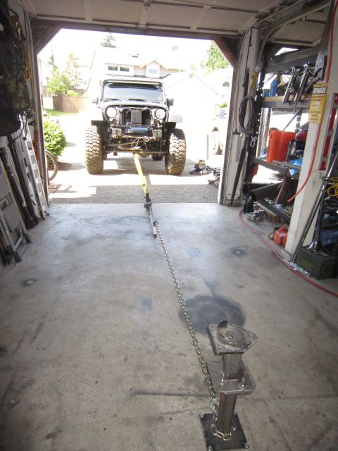 2008 Jeep Wrangler - Jeep Wrangler front end removed, parked in garage with tow strap attached to a ground anchor.