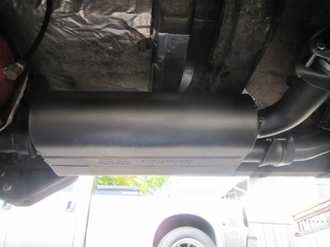 2008 Jeep Wrangler - Underside view of a Flowmaster muffler and exhaust system components.