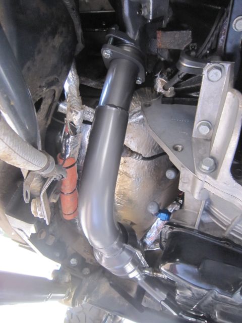 2008 Jeep Wrangler - Close-up view of engine components including exhaust and heat shielding.