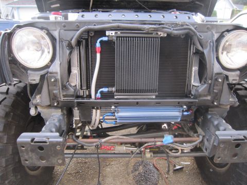2008 Jeep Wrangler - The front of a Jeep Wrangler shows modifications including an aftermarket oil cooler and radiator.