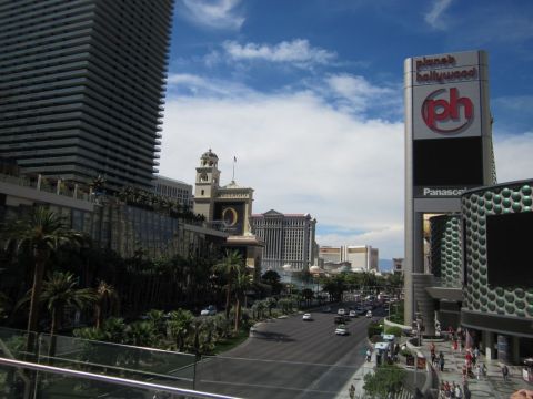 1991 Ford LTD Crown Victoria - Street view of the Las Vegas Strip, the Planet Hollywood sign and traffic on a sunny day.