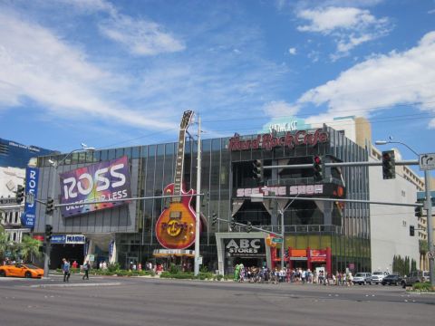 1991 Ford LTD Crown Victoria - An orange sports car is visible on a street in front of the Hard Rock Cafe in Las Vegas.