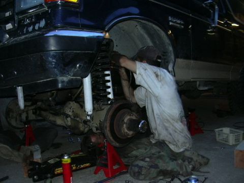 1991 Ford Bronco - Working on the rear suspension of a 1991 Ford Bronco during a lift kit installation.