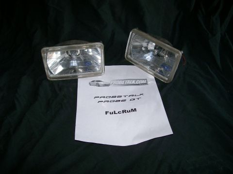 1995 Ford Probe - Two fog lights are displayed with documentation that mentions "PROBE GT" and "PROBETALK.COM".
