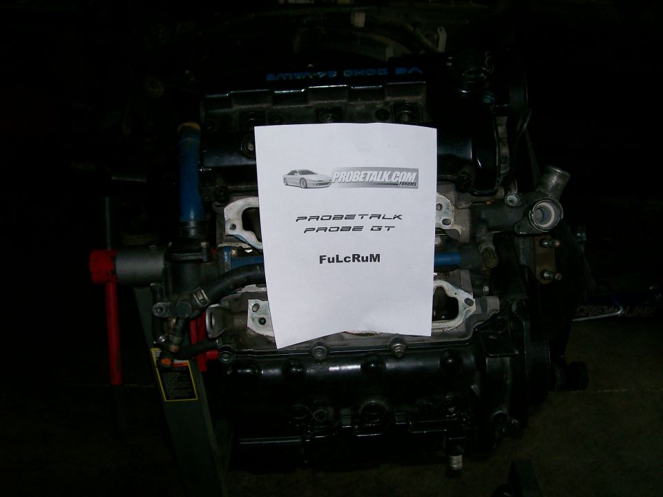 Engine block with a paper showing PROBETALK.COM and PROBE GT
