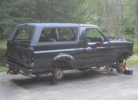 1993 Ford Bronco - This 1993 Ford Bronco is missing its wheels and appears to be undergoing repairs or disassembly.