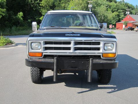 1987 Dodge 1500 - Front view of a black Dodge pickup truck with a silver grille and an aftermarket bumper.