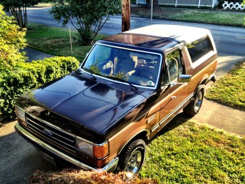 1991 Ford Bronco - This 1991 Ford Bronco is parked on a residential street, its two-tone paint scheme.