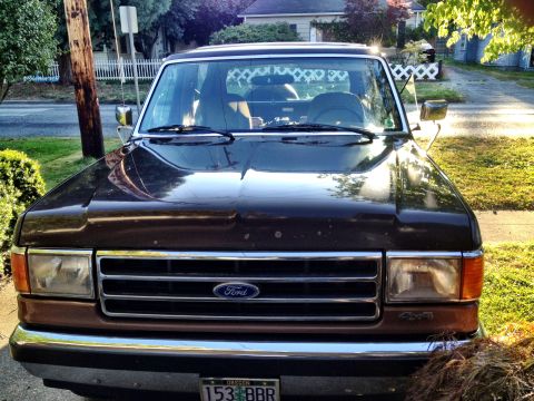 1991 Ford Bronco - This 1991 Ford Bronco is shown from the front, with a residential street in the background.