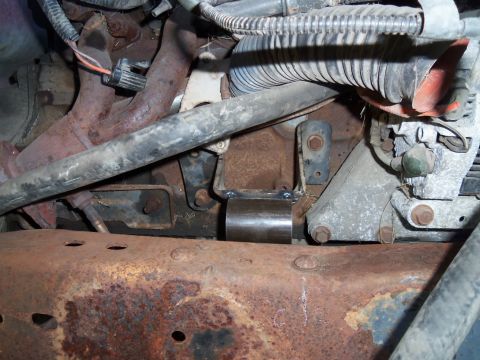 1987 Ford Ranger - Custom engine mount bracket installed on a rusty vehicle frame.