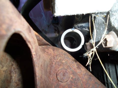 1987 Ford Ranger - Detail shot of heavily rusted vehicle undercarriage components, including part of the frame and suspension.