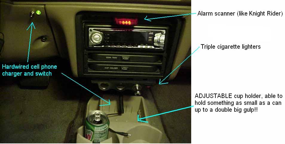 Truck interior center stack with JVC head unit, labeled arrows pointing to charger, lighters and a cup holder with can