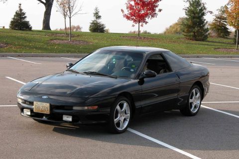 1997 Ford Taurus - This black 1997 Ford Probe GT coupe is seen from a three-quarter front view in a parking lot.