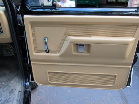 1987 Dodge 1500 - Interior view of the driver's side door panel on a 1987 Dodge 1500 pickup truck.
