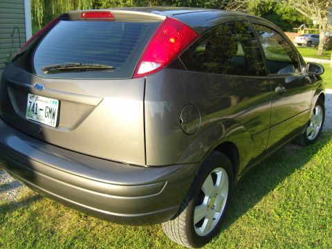 2007 Ford Mustang - This gray hatchback is shown from the rear, displaying a Tennessee license plate.