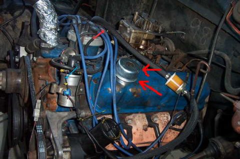 1980 Ford Bronco - Close-up view of an engine bay, focusing on the valve covers and associated components.