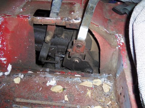 1968 Ford Bronco - The interior floor pan and transmission tunnel show signs of rust and wear, with visible mechanical linkages.