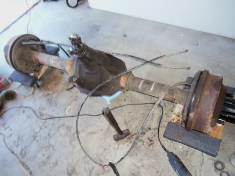 1968 Ford Bronco - A disassembled rear axle assembly, likely for a truck or SUV, is shown resting on wooden blocks.