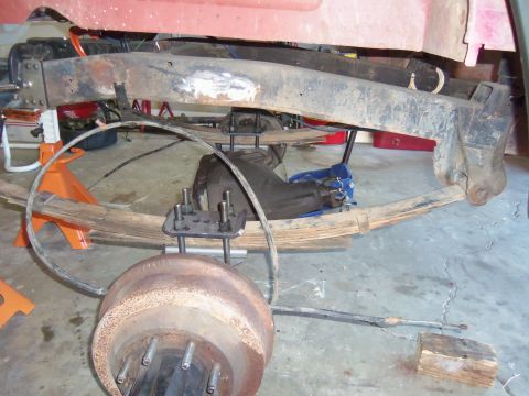1968 Ford Bronco - Close-up view of a vehicle's rear axle assembly and suspension components.