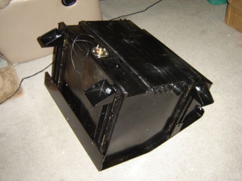 1968 Ford Bronco - This is a black metal fuel tank with a sender unit and mounting brackets visible.
