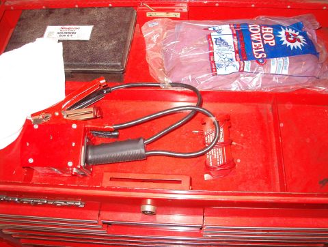 2004 Land Rover Land Rover - Overflow Soldering gun (in box) Battery load tester (same color red as the tool box)