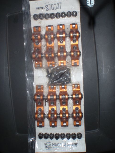 2000 Dodge 1500 - New engine valve train parts, including rocker arms and hardware, are packaged for sale.