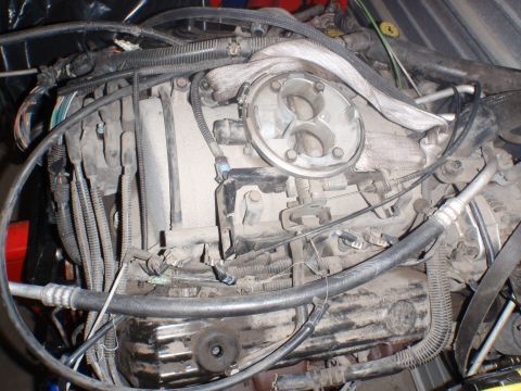 2000 Dodge 1500 - Close-up view of a dusty engine, showing intricate wiring and plumbing systems.