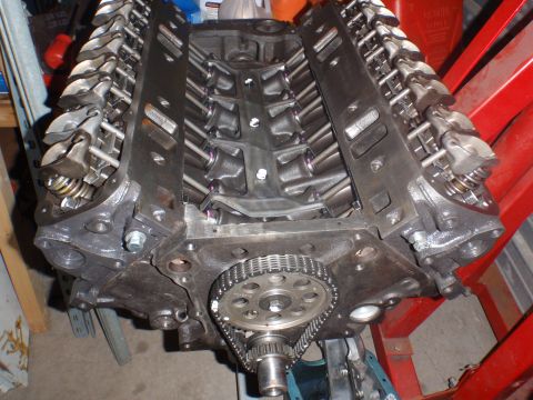 2000 Dodge 1500 - Close-up of a V8 engine block with exposed valve train components and timing chain.