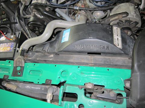1991 Ford LTD Crown Victoria - Close-up view of a vehicle's engine bay, focusing on the radiator and fan assembly.