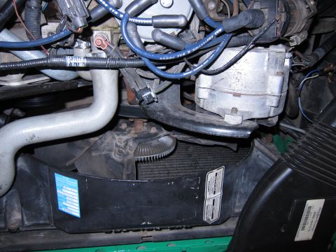1991 Ford LTD Crown Victoria - Close-up view of engine bay components including radiator, fan, and alternator.