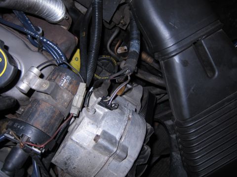 1991 Ford LTD Crown Victoria - Engine bay components are visible in this close-up shot, showing various wires and mechanical parts.