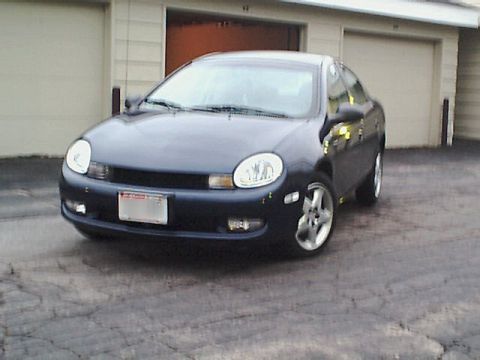 2000 Dodge Neon - Front view of a dark blue 2000 Dodge Neon sedan parked outside.