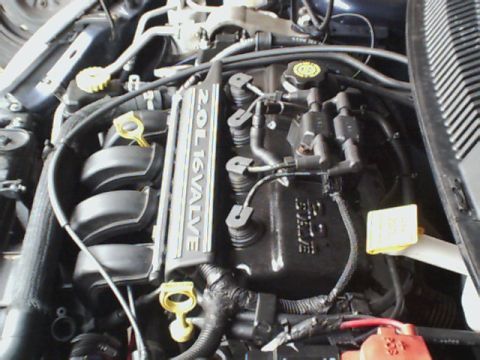 2000 Dodge Neon - Close-up view of a 2.0L 16-valve engine, likely from a Dodge vehicle.