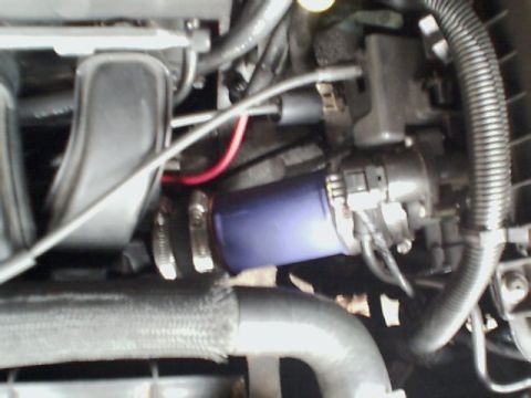 2000 Dodge Neon - Engine bay components including hoses and wiring are visible in this close-up shot.