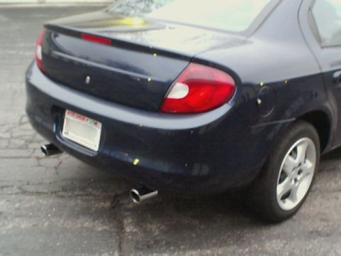2000 Dodge Neon - Rear view of a dark blue 2000 Dodge Neon sedan, dual exhaust pipes and a subtle spoiler.