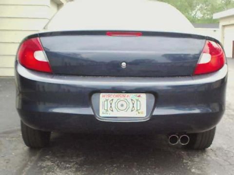 2000 Dodge Neon - Rear view of a 2000 Dodge Neon showing its taillights, license plate, and dual exhaust pipes.