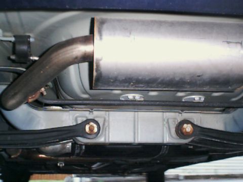 2000 Dodge Neon - Underside view shows the exhaust system and rear suspension components of a vehicle.
