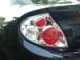 2000 Dodge Neon - Close-up of a black car's rear tail light assembly.
