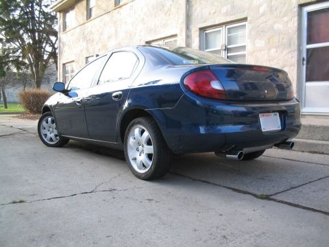 2000 Dodge Neon - Rear view of a dark blue 2000 Dodge Neon sedan with dual exhaust pipes.