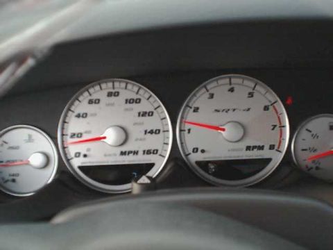 2000 Dodge Neon - The dashboard gauges show the speedometer at 0 MPH and the tachometer at 0 RPM, with SRT-4 branding visible.