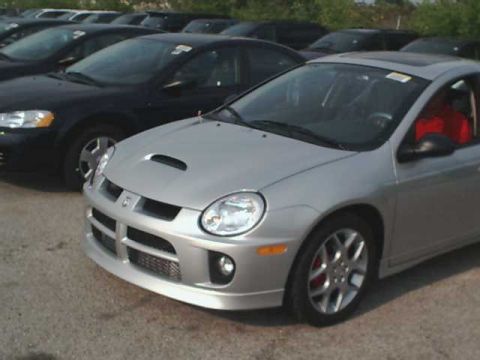 2000 Dodge Neon - A silver Dodge Neon SRT-4 is parked in a lot with other vehicles.